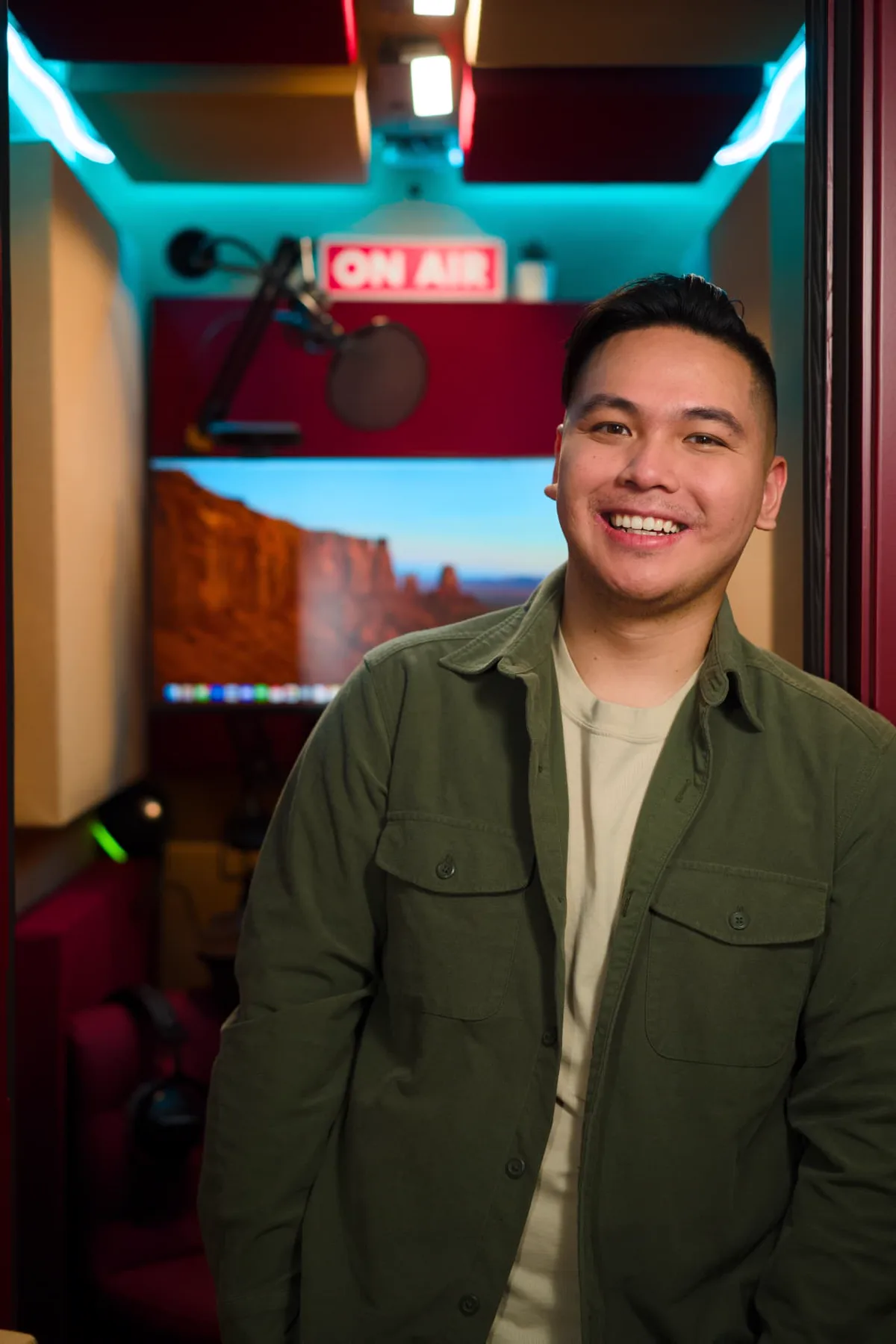 Topher Ngo in his home studio booth